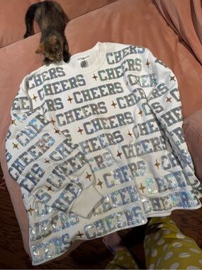 QUEEN OF SPARKLES White Sweatshirt with Holographic 'CHEERS' Sequins